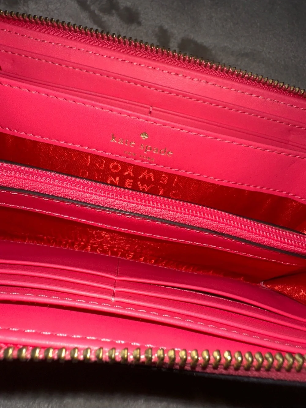 kate spade coral pink pebbled leather wristlet